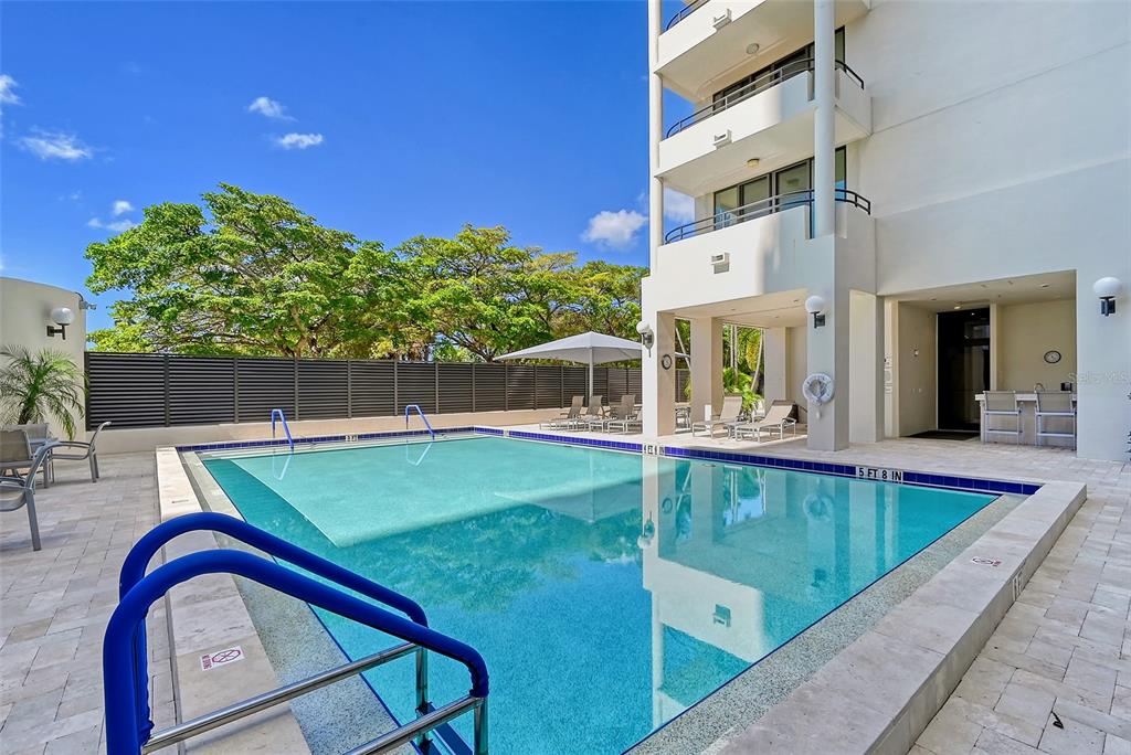 1255 North Gulfstream Avenue, Unit 1101 Sarasota, FL 34236 - Photo 67 of 75 a view of outdoor space swimming pool and furniture