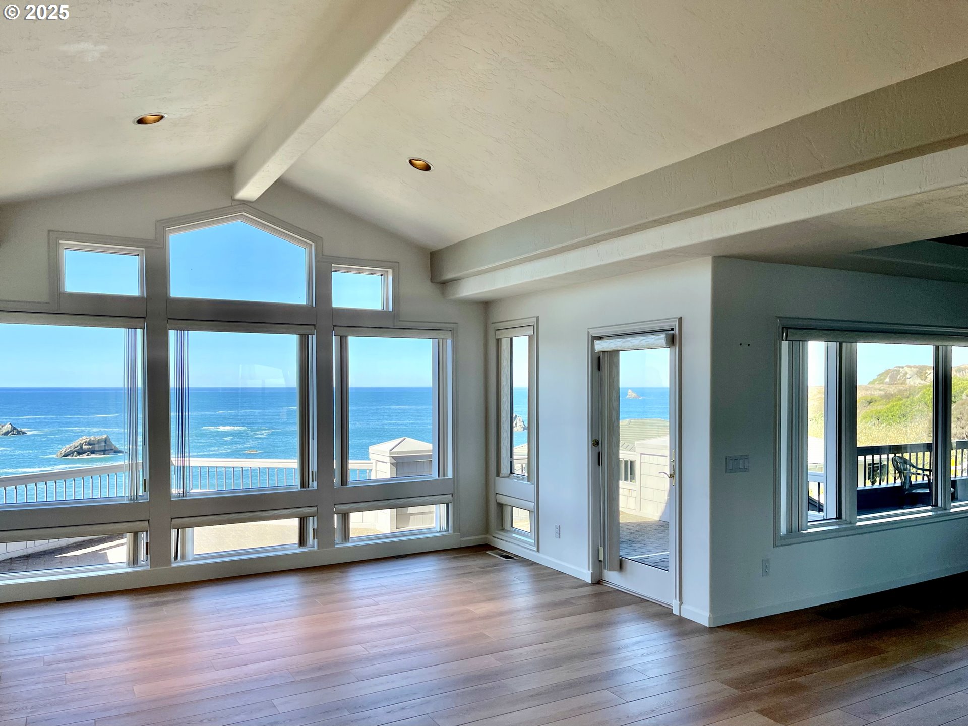 96448 Shorewood Terrace Brookings, OR 97415 - Photo 14 of 48 a view of an entryway with wooden floor and windows