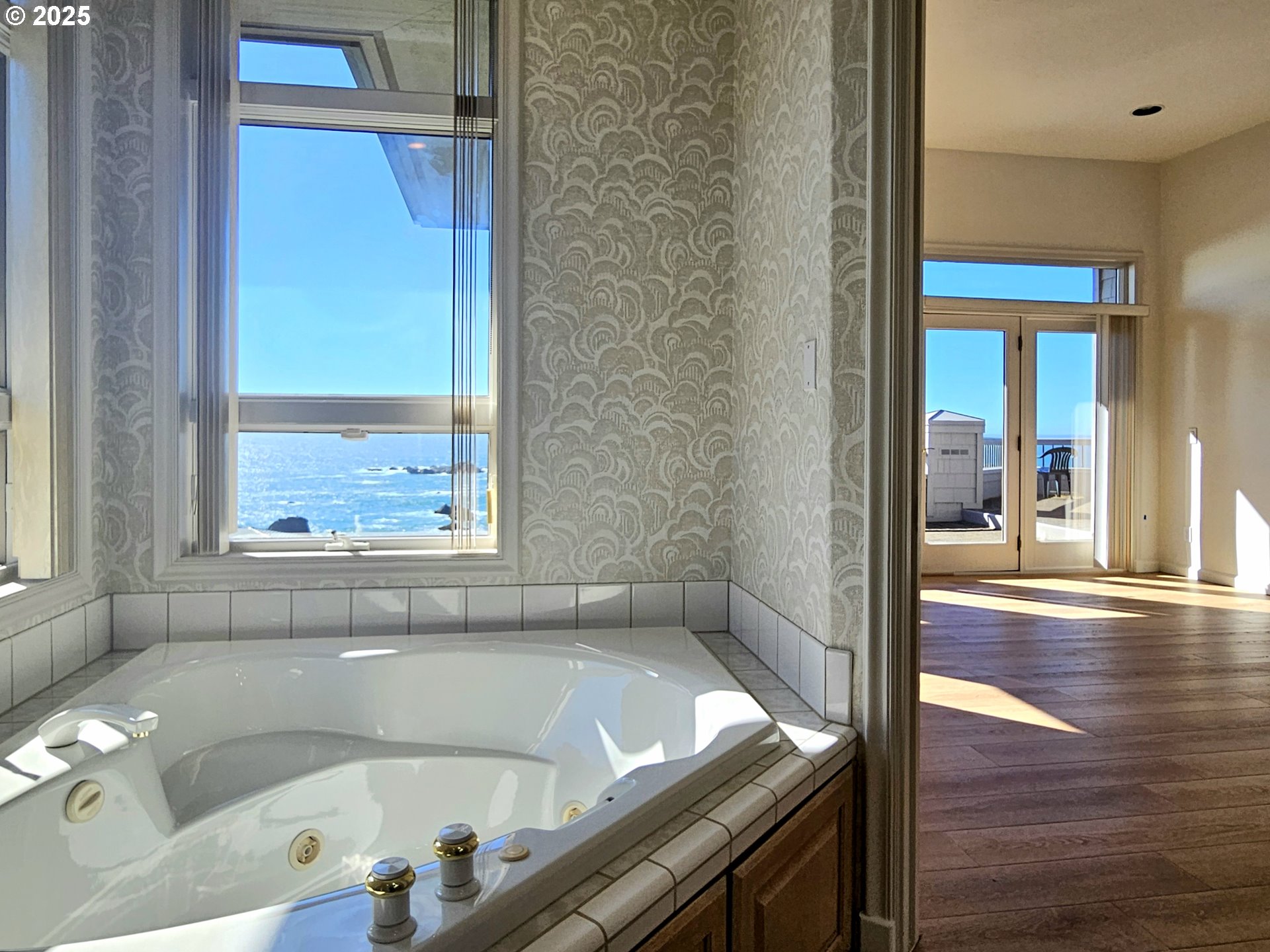 96448 Shorewood Terrace Brookings, OR 97415 - Photo 23 of 48 a bath tub sitting in a bathroom next to a window