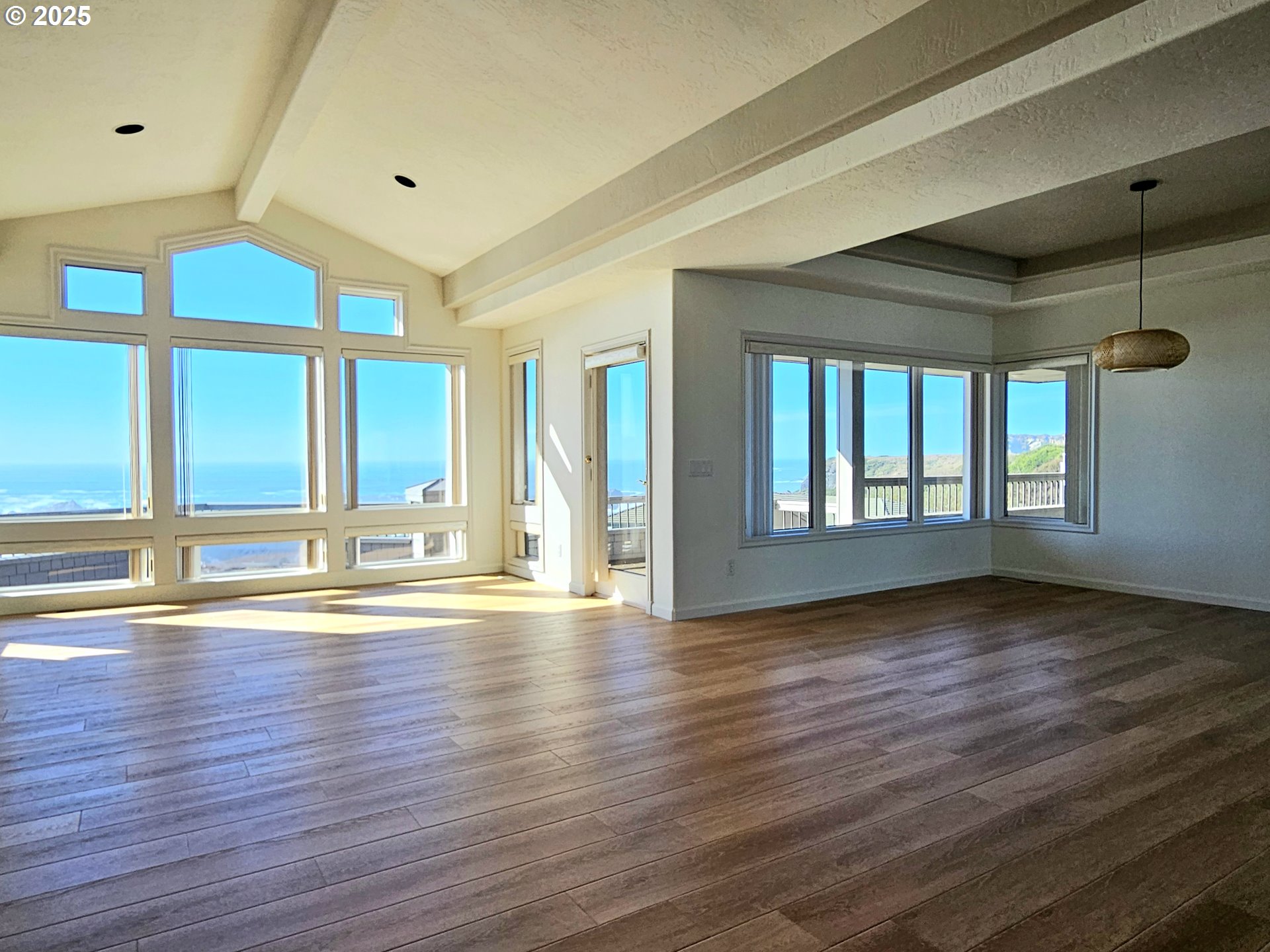96448 Shorewood Terrace Brookings, OR 97415 - Photo 10 of 48 a view of an empty room with wooden floor and a window