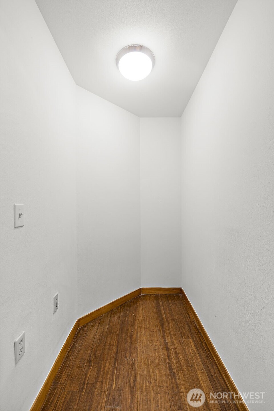 827 Hiawatha Place South, Unit 313 Seattle, WA 98144 - Photo 14 of 25 a view of empty room with wooden floor