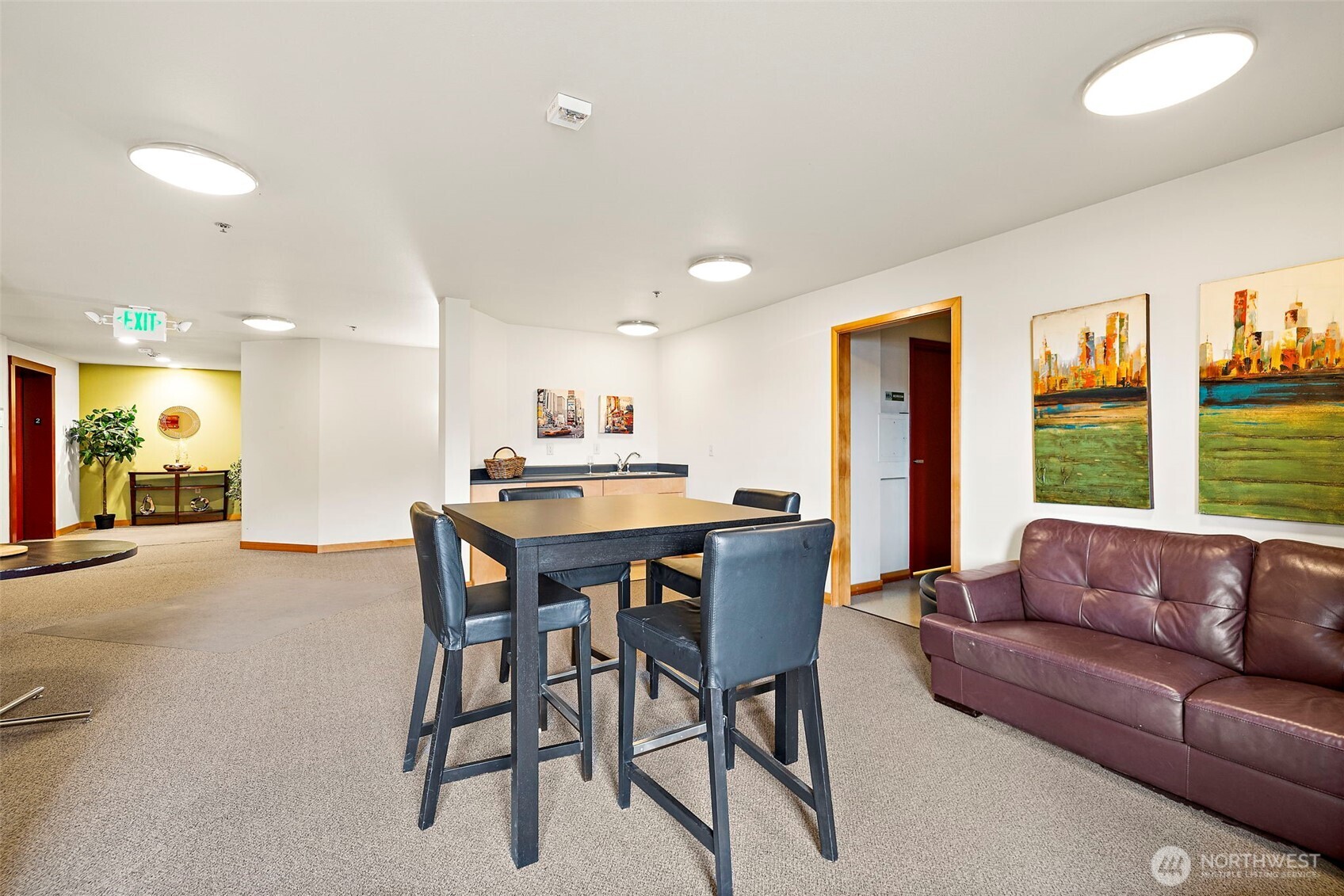827 Hiawatha Place South, Unit 313 Seattle, WA 98144 - Photo 16 of 25 a living room with furniture a refrigerator and a kitchen
