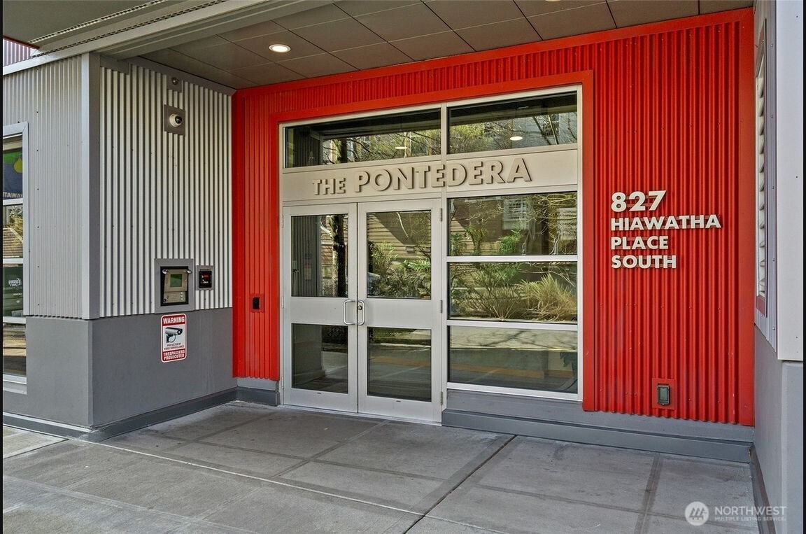 827 Hiawatha Place South, Unit 313 Seattle, WA 98144 - Photo 21 of 25 a front view of a building with glass windows and door