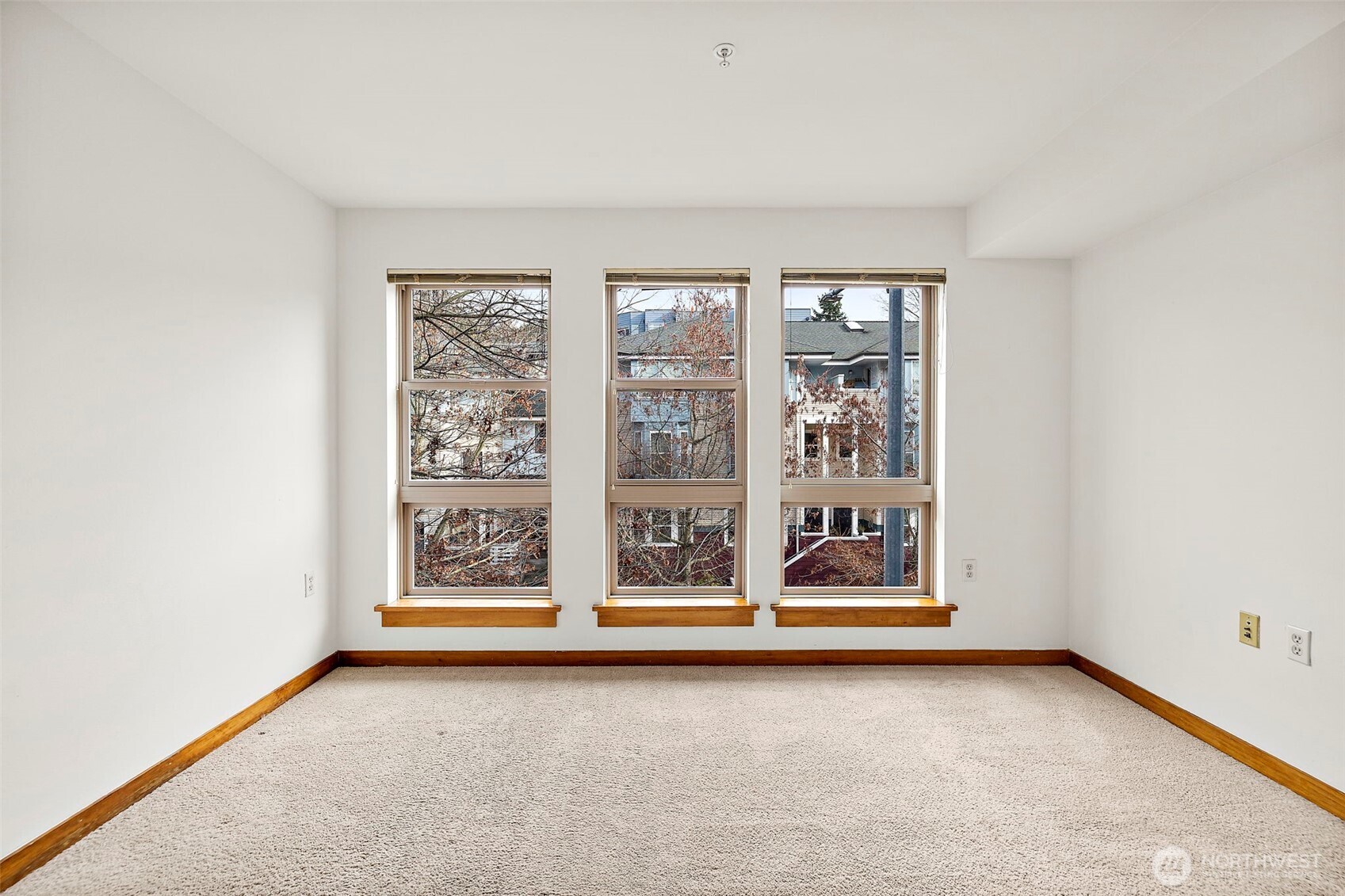 827 Hiawatha Place South, Unit 313 Seattle, WA 98144 - Photo 4 of 25 an empty room with window