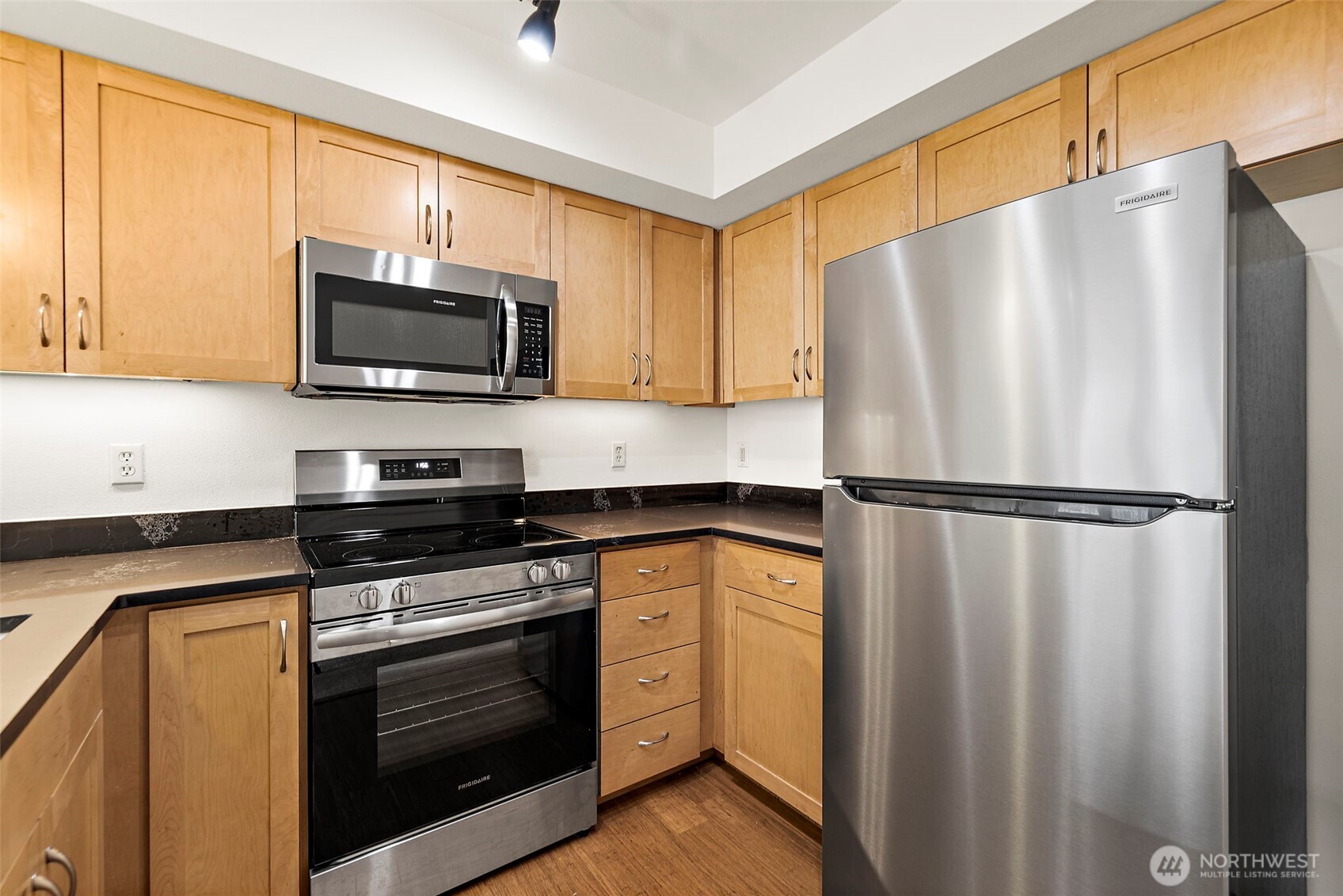 827 Hiawatha Place South, Unit 313 Seattle, WA 98144 - Photo 8 of 25 a kitchen with a refrigerator stove and microwave