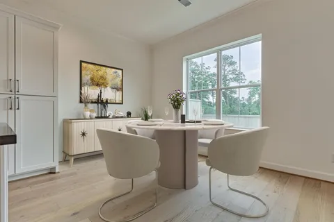 a living room with a window and a table