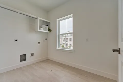 a view of an empty room with windows