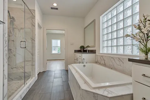 a white bath tub sitting next to a window
