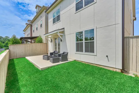 a view of backyard with a patio