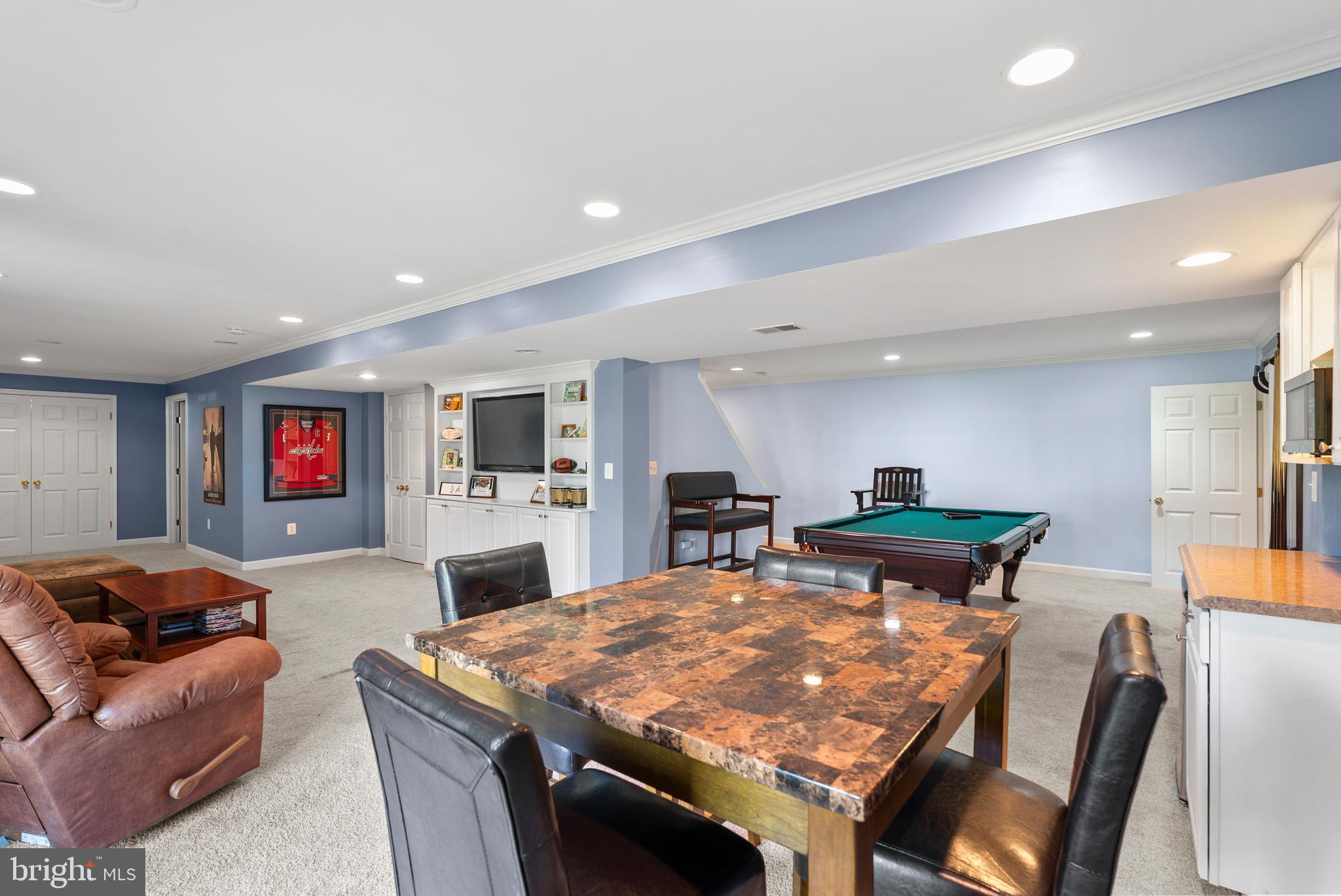 7 Redtree Lane Reisterstown, MD 21136 - Photo 49 of 56 a living room with furniture a flat screen tv and kitchen view