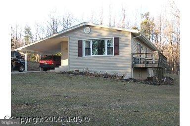 4838 Teen Barnes Road Frederick, MD 21703 - Photo 1 of 1 a front view of a house with a yard
