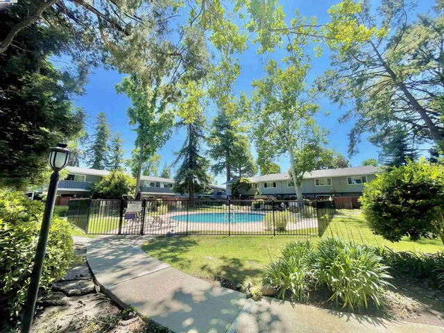 a view of a swimming pool with a patio