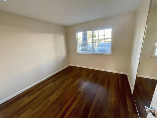 a view of wooden floor in an empty room