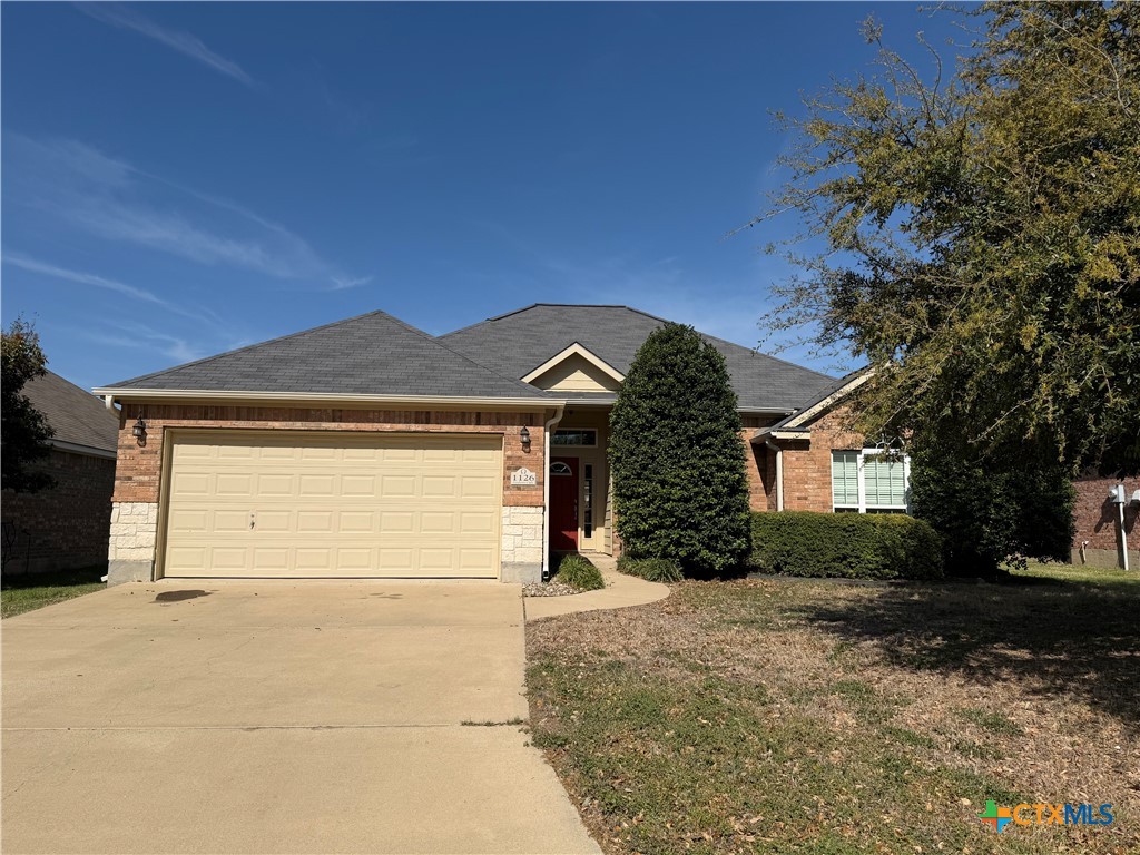 1126 Neuberry Cliffe Temple, TX 76502 - Photo 1 of 19 a front view of a house with a yard and garage