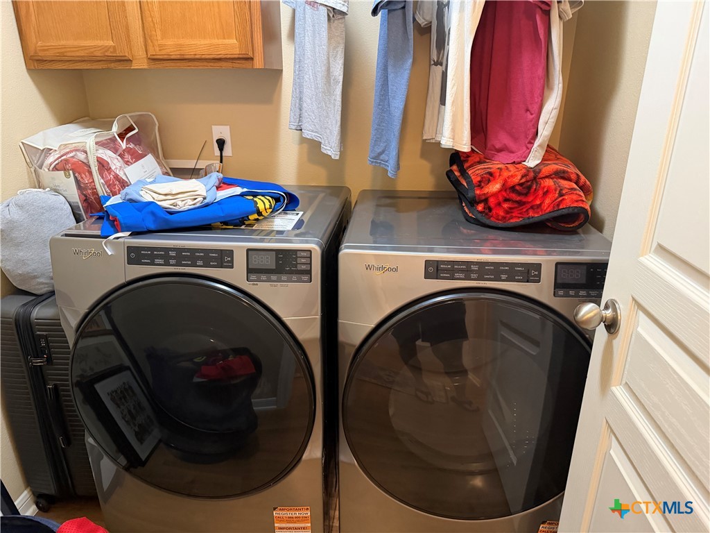1126 Neuberry Cliffe Temple, TX 76502 - Photo 12 of 19 a utility room with dryer and washer
