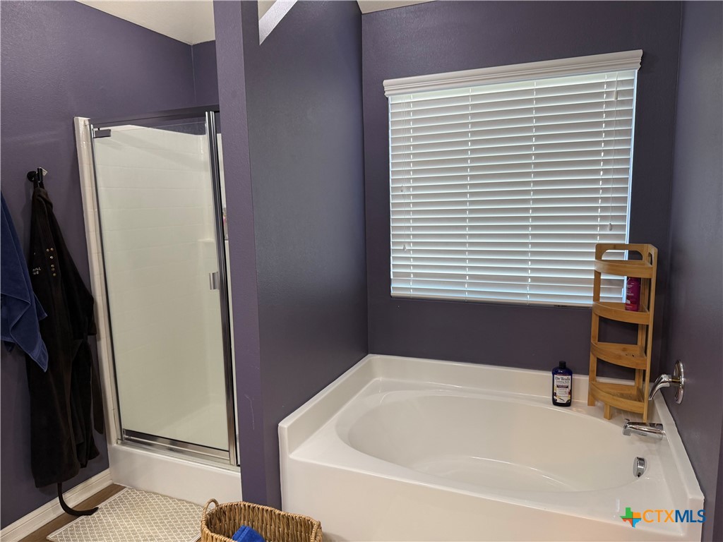 1126 Neuberry Cliffe Temple, TX 76502 - Photo 13 of 19 a bathroom with a bathtub and a window