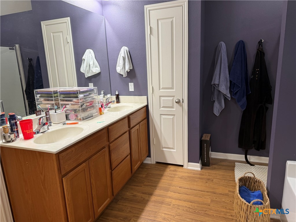 1126 Neuberry Cliffe Temple, TX 76502 - Photo 14 of 19 a bathroom with a sink vanity and a mirror
