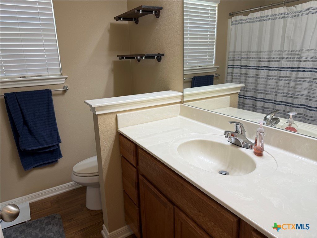 1126 Neuberry Cliffe Temple, TX 76502 - Photo 18 of 19 a bathroom with a sink and a toilet
