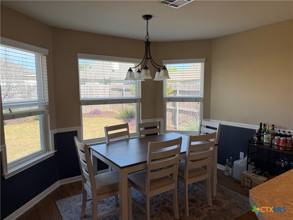 1126 Neuberry Cliffe Temple, TX 76502 - Photo 4 of 19 a view of a dining room with furniture window and outside view