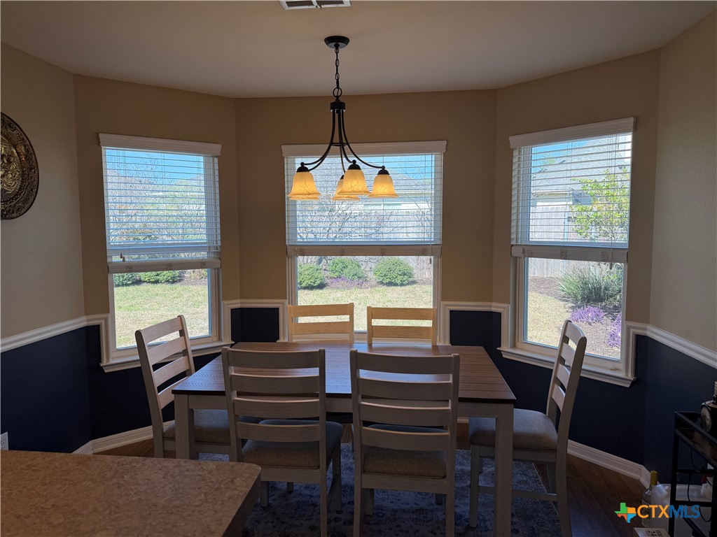 1126 Neuberry Cliffe Temple, TX 76502 - Photo 7 of 19 a living room with furniture a table and a large window