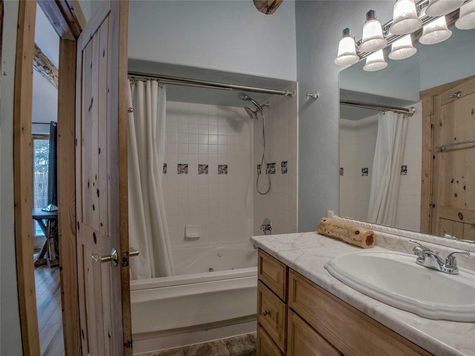 46 Singleton Road Alma, CO 80420 - Photo 20 of 50 a bathroom with a granite countertop sink a toilet and shower