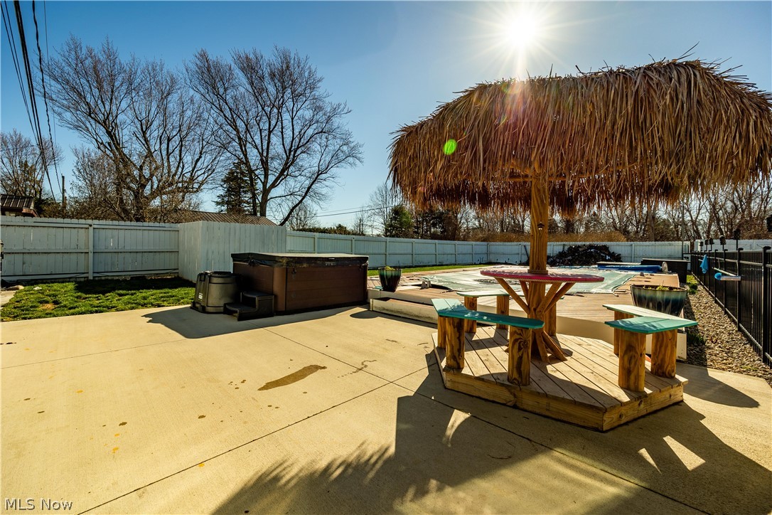 44 Center Road Vermilion, OH 44089 - Photo 36 of 38 View of patio featuring a swimming pool with hot tub