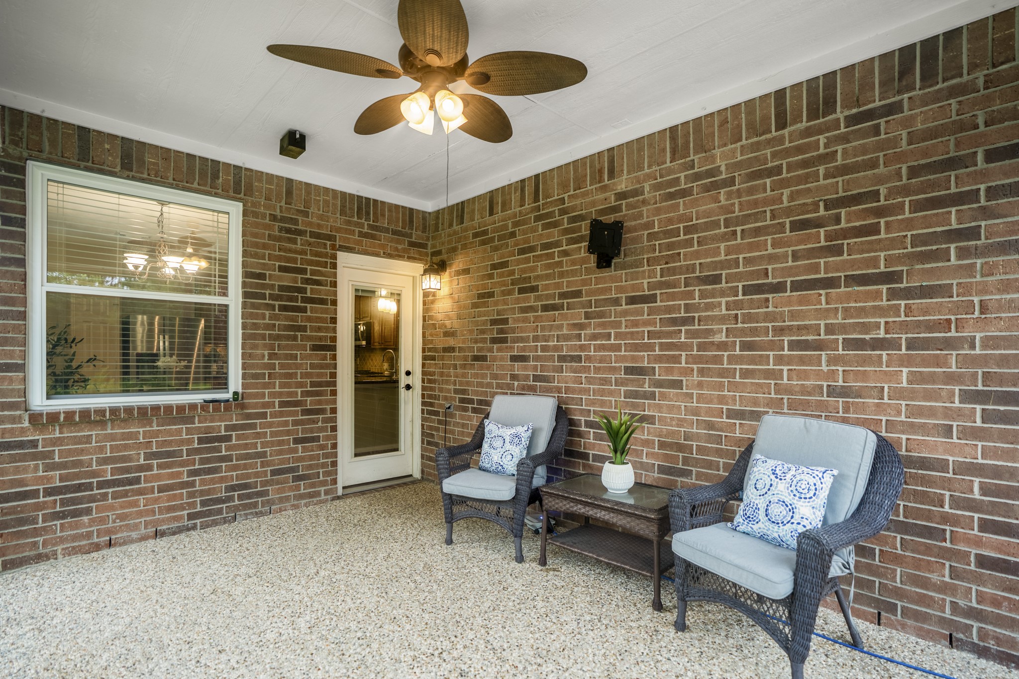 6311 Sparrows Glen Lane Spring, TX 77379 - Photo 32 of 50 Looking back at the covered patio we can feel the everyday ease of this outdoor space, with a ceiling fan overhead, room to sit in the shade, and direct access back into the kitchen and breakfast area.