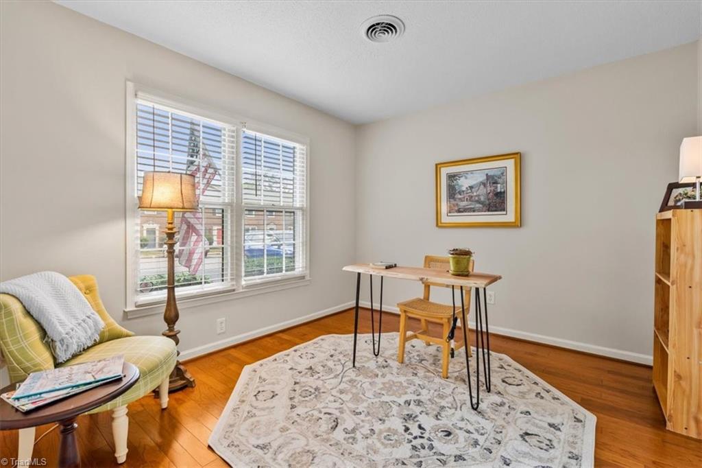 4847 Tower Road, Unit D Greensboro, NC 27410 - Photo 13 of 19 2nd bedroom currently staged as a home office, but perfect for guest bedroom!