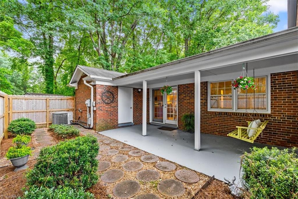 4847 Tower Road, Unit D Greensboro, NC 27410 - Photo 18 of 19 Privacy fenced backyard space perfect for adding a small garden and flowers. Don't miss the extra exterior storage closet.