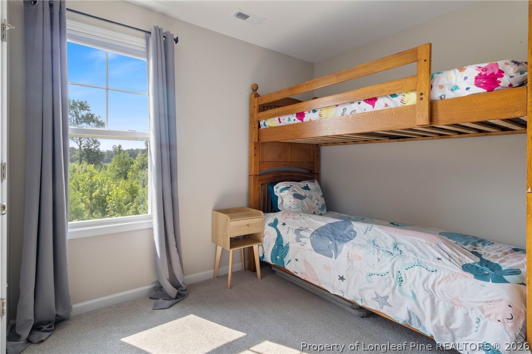 1368 Talmage Road St. Pauls, NC 28384 - Photo 14 of 26 a bedroom with a bed and a window