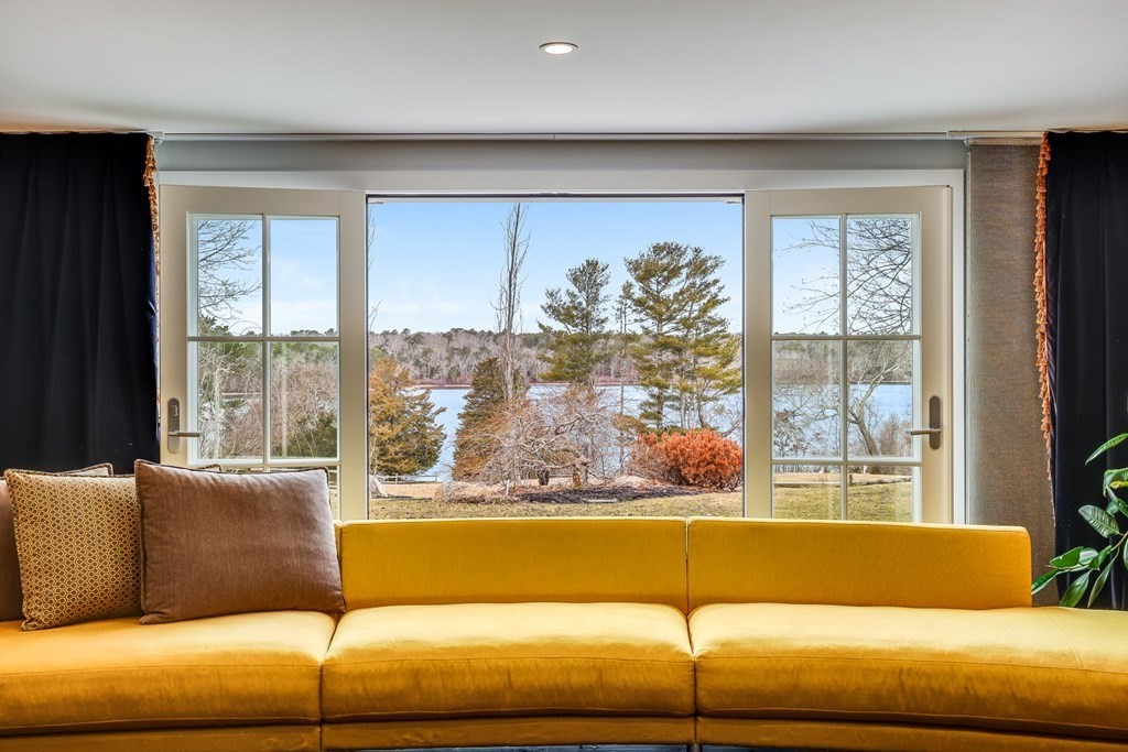 75 Great Hill Road Sandwich, MA 02563 - Photo 11 of 42 a living room with furniture and large windows
