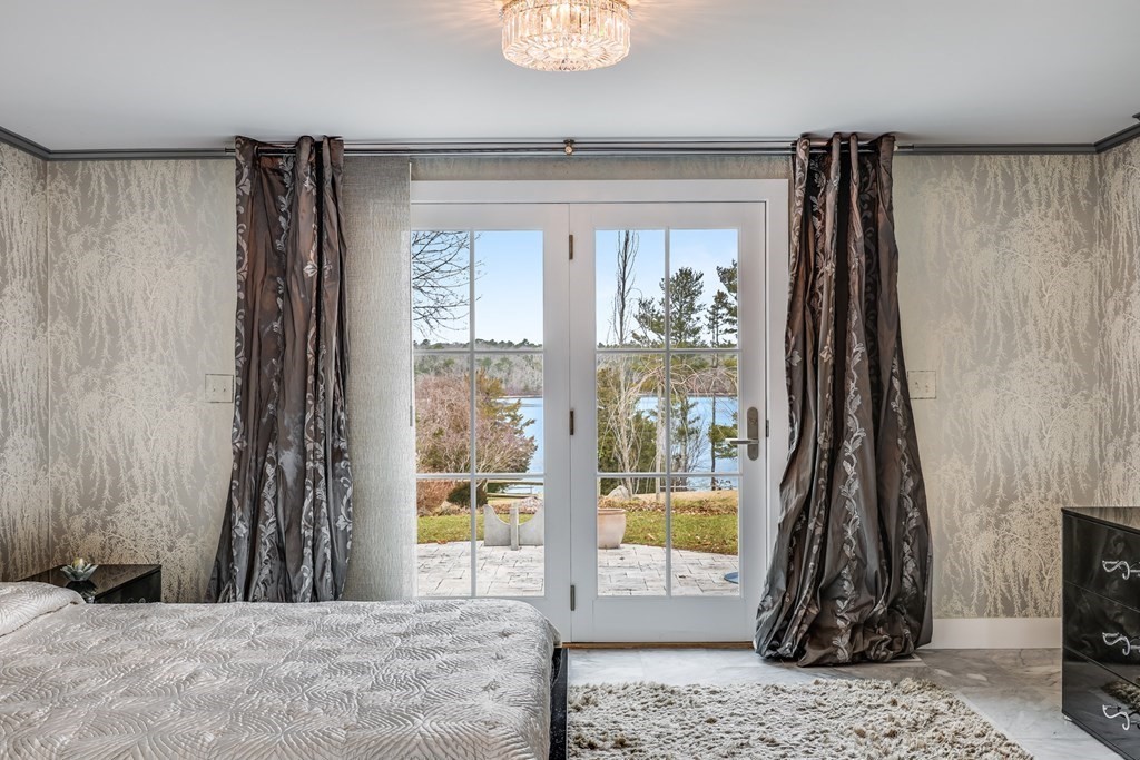 75 Great Hill Road Sandwich, MA 02563 - Photo 15 of 42 a view of a floor to ceiling window and potted plant