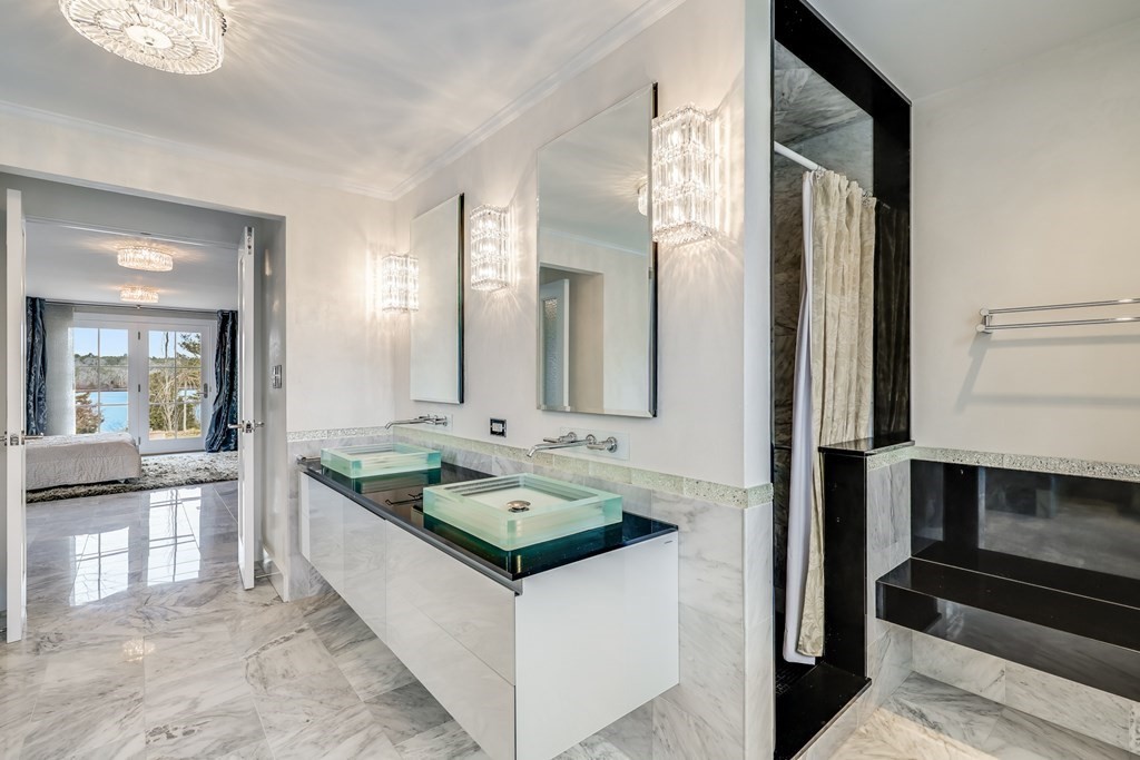 75 Great Hill Road Sandwich, MA 02563 - Photo 17 of 42 a bathroom with a double vanity sink and mirror