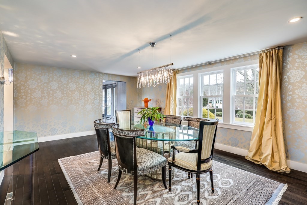75 Great Hill Road Sandwich, MA 02563 - Photo 20 of 42 a dining room with furniture a chandelier and wooden floor