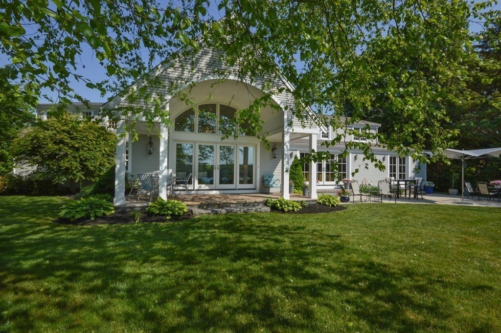 75 Great Hill Road Sandwich, MA 02563 - Photo 2 of 42 a large tree in front of a house with a big yard