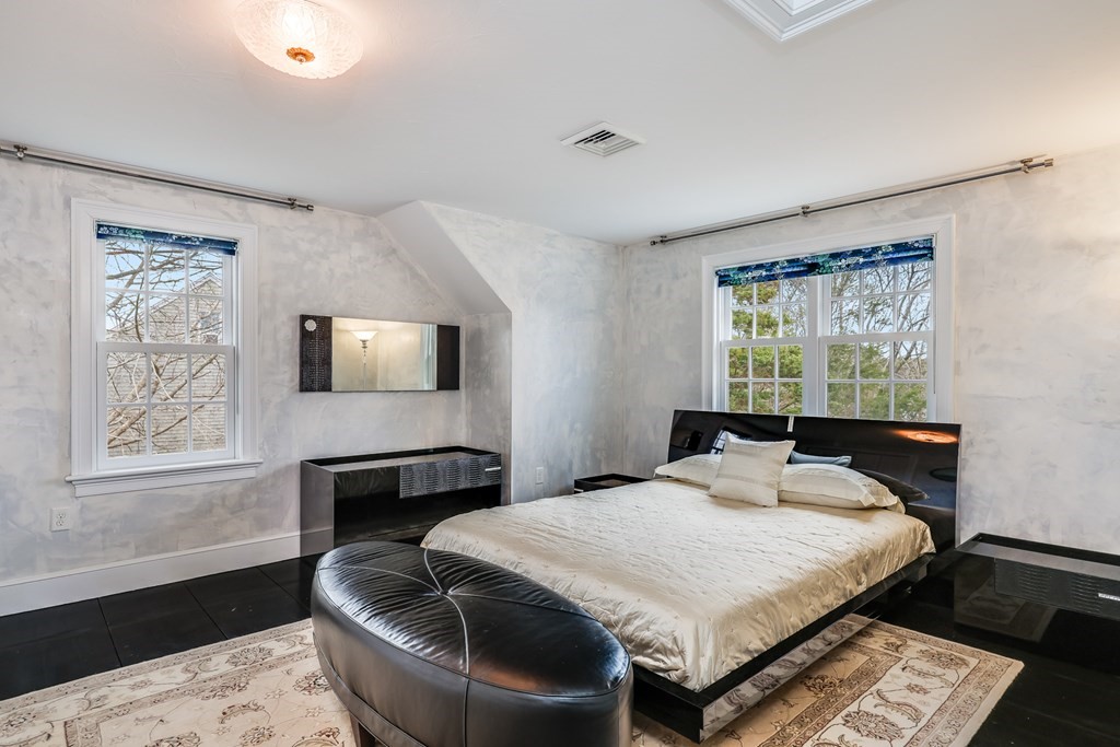 75 Great Hill Road Sandwich, MA 02563 - Photo 23 of 42 a bedroom with a bed and wooden floor