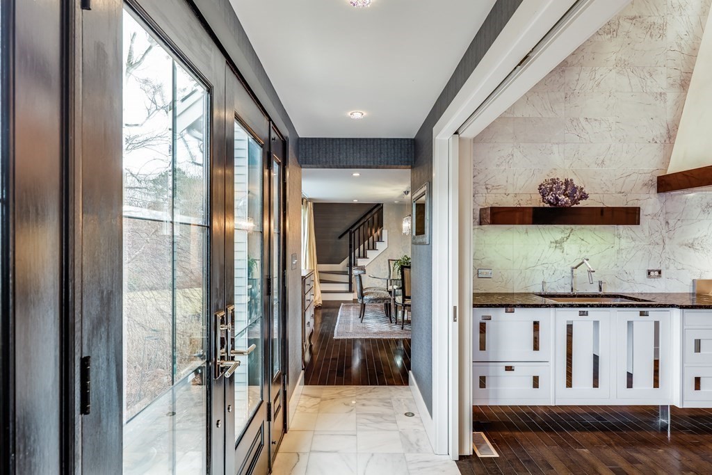 75 Great Hill Road Sandwich, MA 02563 - Photo 28 of 42 a view of a hallway to a livingroom with wooden floor and furniture