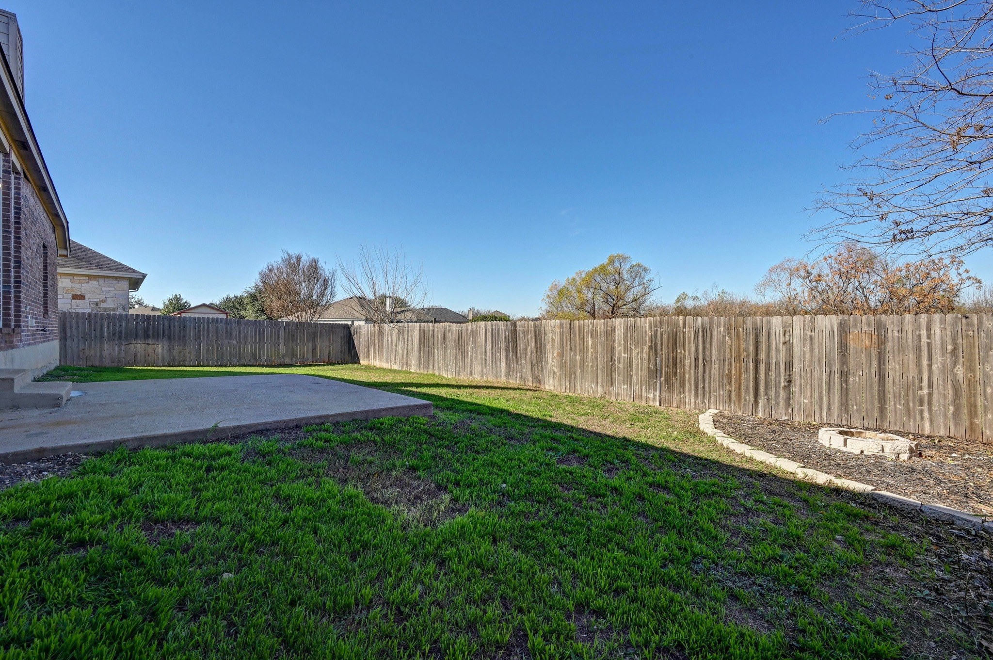 198 Valruth Drive Kyle, TX 78640 - Photo 29 of 32 Fenced backyard featuring a patio