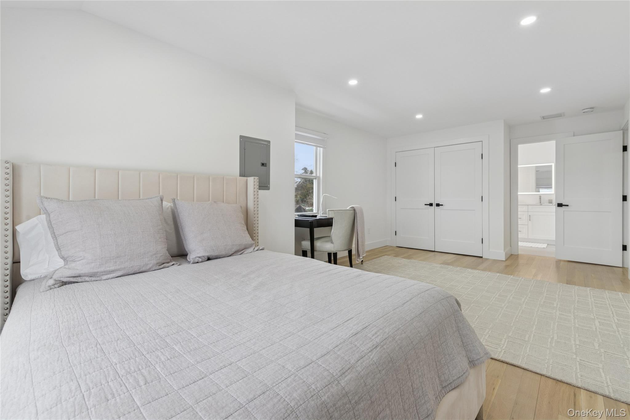 10 Sagamore Road Hampton Bays, NY 11946 - Photo 27 of 41 a large white bed in a white room