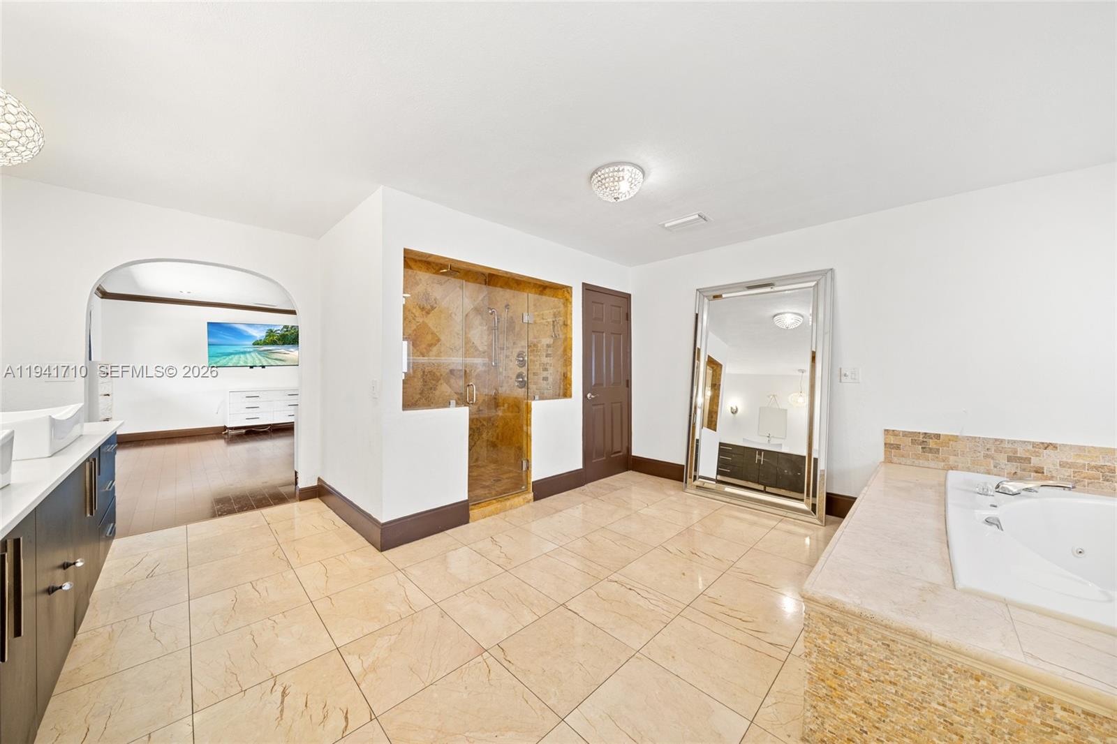 9461 Southwest 128th Street Miami, FL 33176 - Photo 11 of 24 a view of an empty room with window and a kitchen view
