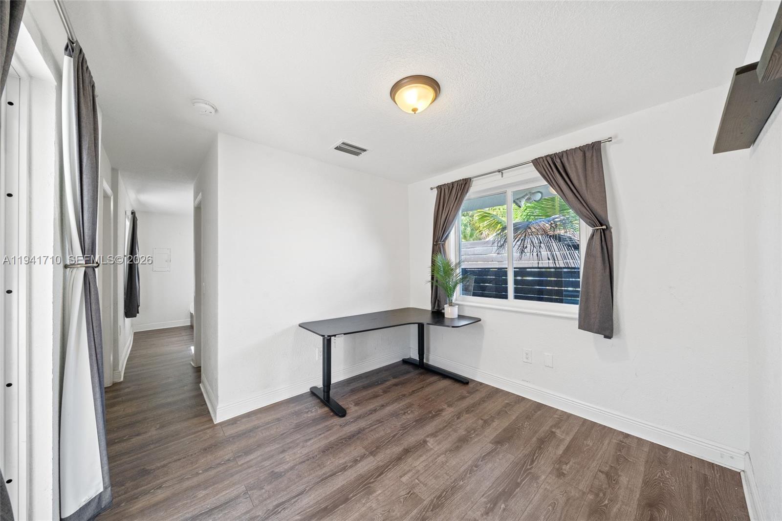 9461 Southwest 128th Street Miami, FL 33176 - Photo 21 of 24 a view of entryway with wooden floor and window