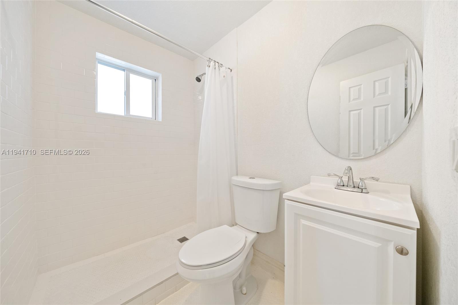 9461 Southwest 128th Street Miami, FL 33176 - Photo 22 of 24 a bathroom with a sink toilet and mirror