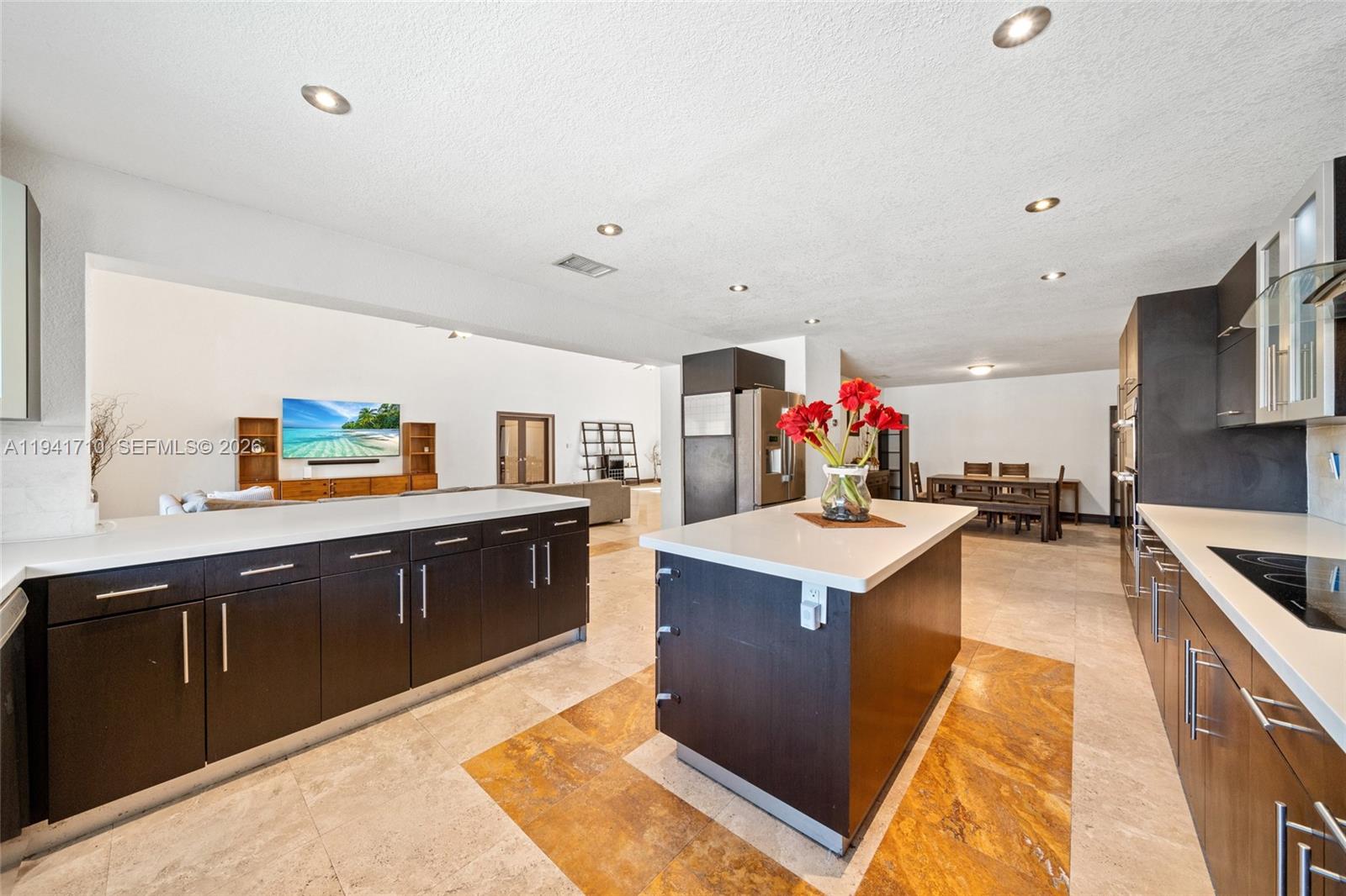9461 Southwest 128th Street Miami, FL 33176 - Photo 7 of 24 a kitchen with stainless steel appliances granite countertop a sink stove and refrigerator