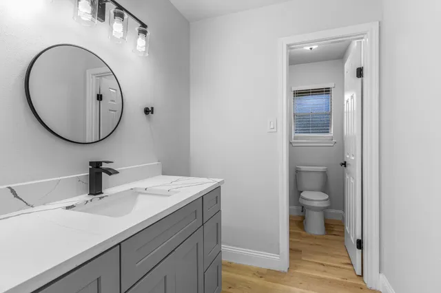 a bathroom with a sink and a mirror