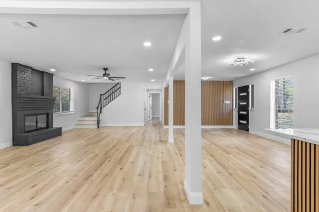 a view of hallway with wooden floor
