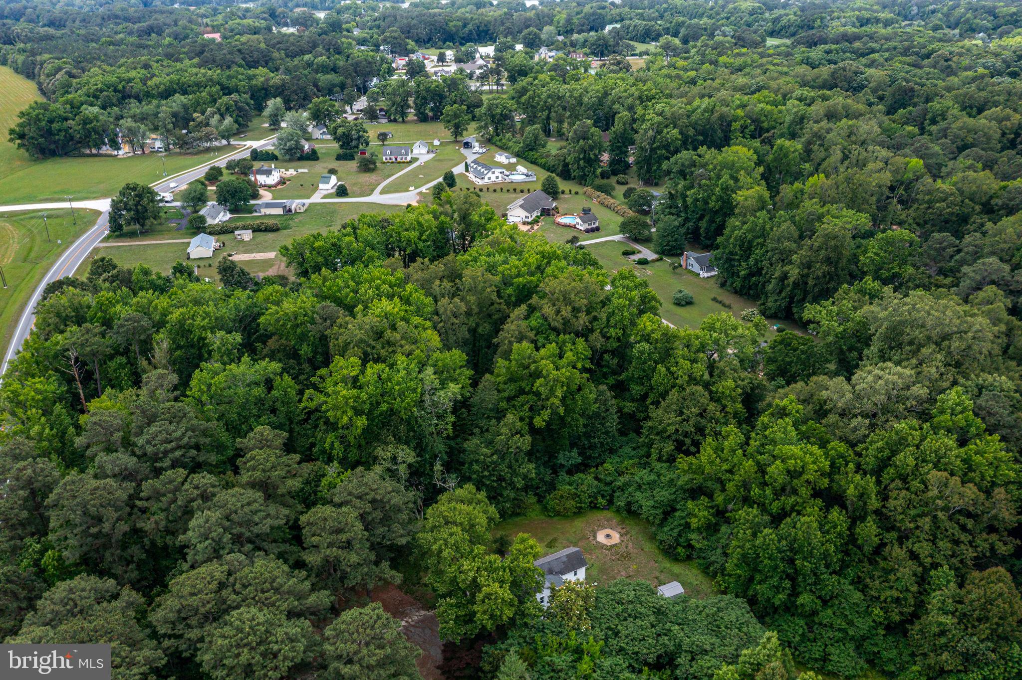 3952 Irvington Road Irvington, VA 22480 - Photo 56 of 77 an aerial view of residential houses with outdoor space and trees