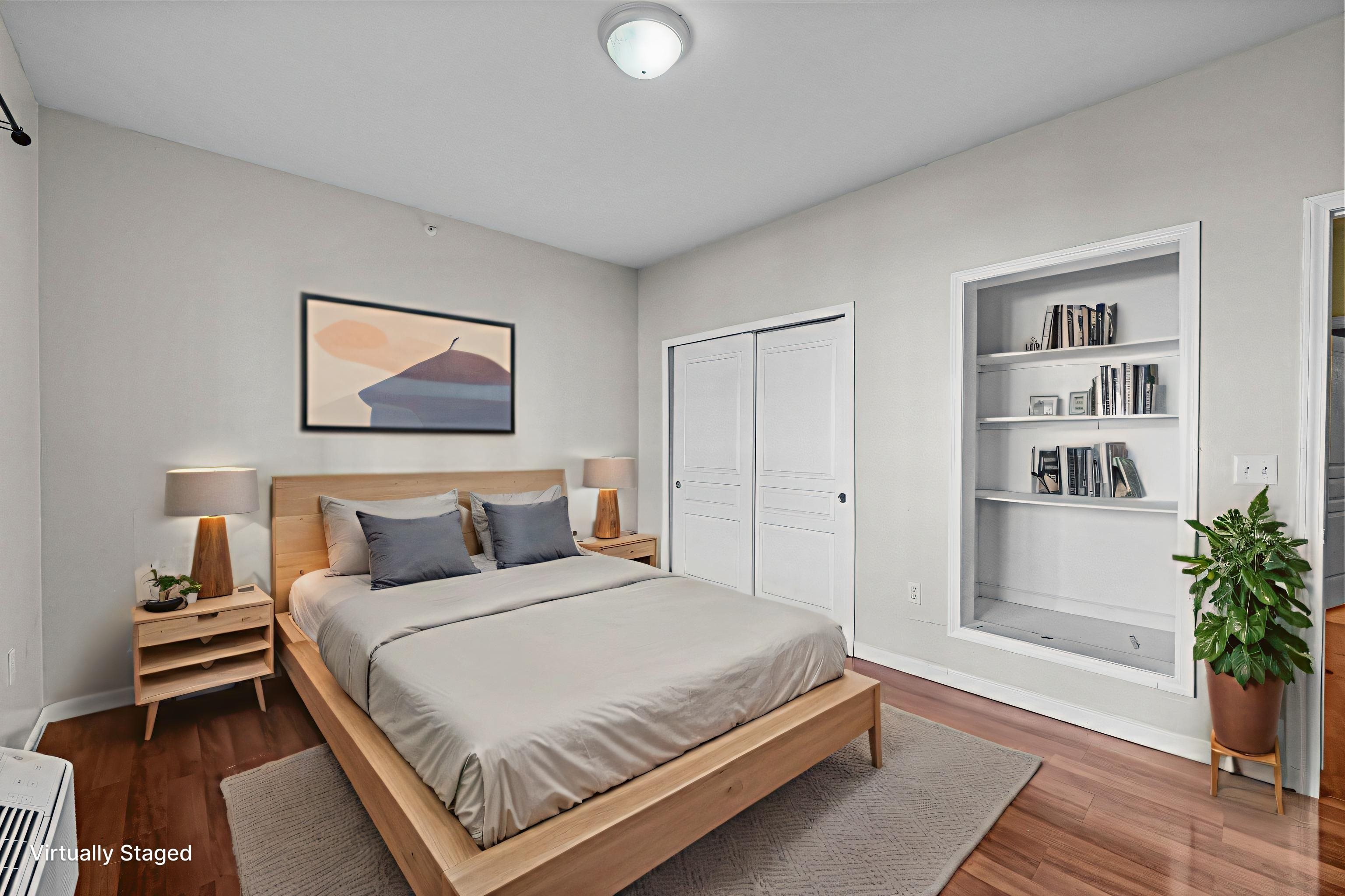 845 Newark Avenue, Unit 3B Jersey City, NJ 07306 - Photo 17 of 26 a bedroom with a bed and a potted plant