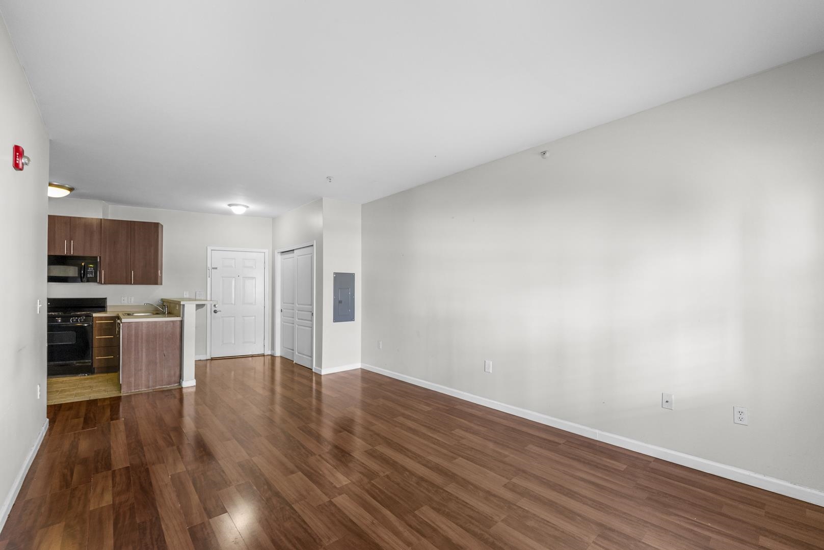 845 Newark Avenue, Unit 3B Jersey City, NJ 07306 - Photo 2 of 26 a view of a kitchen with a sink and a refrigerator