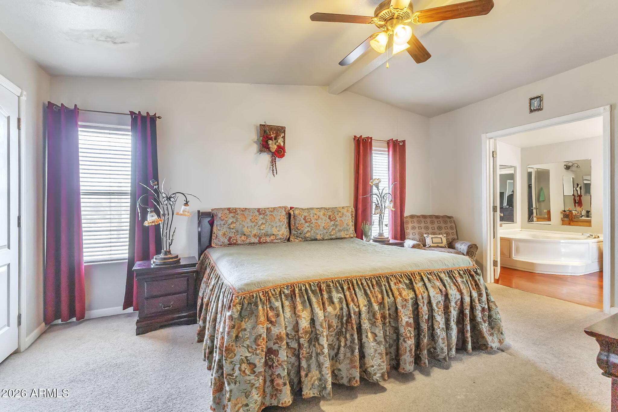 1236 West Judd Road San Tan Valley, AZ 85144 - Photo 12 of 28 a bedroom with a bed and a chandelier