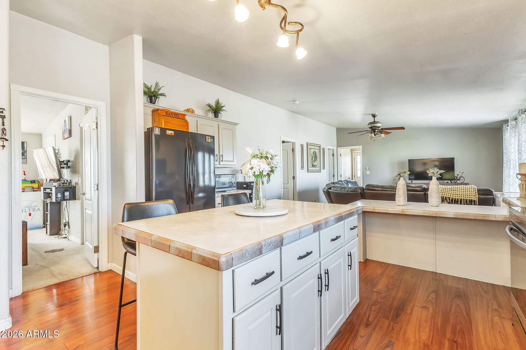 1236 West Judd Road San Tan Valley, AZ 85144 - Photo 16 of 28 a large kitchen with a table and chairs